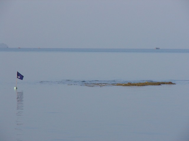 low tide rock off Tanyong Po